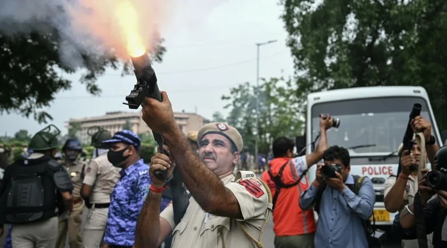 Indian Police Clash with Protesters Demanding Education Minister's Resignation