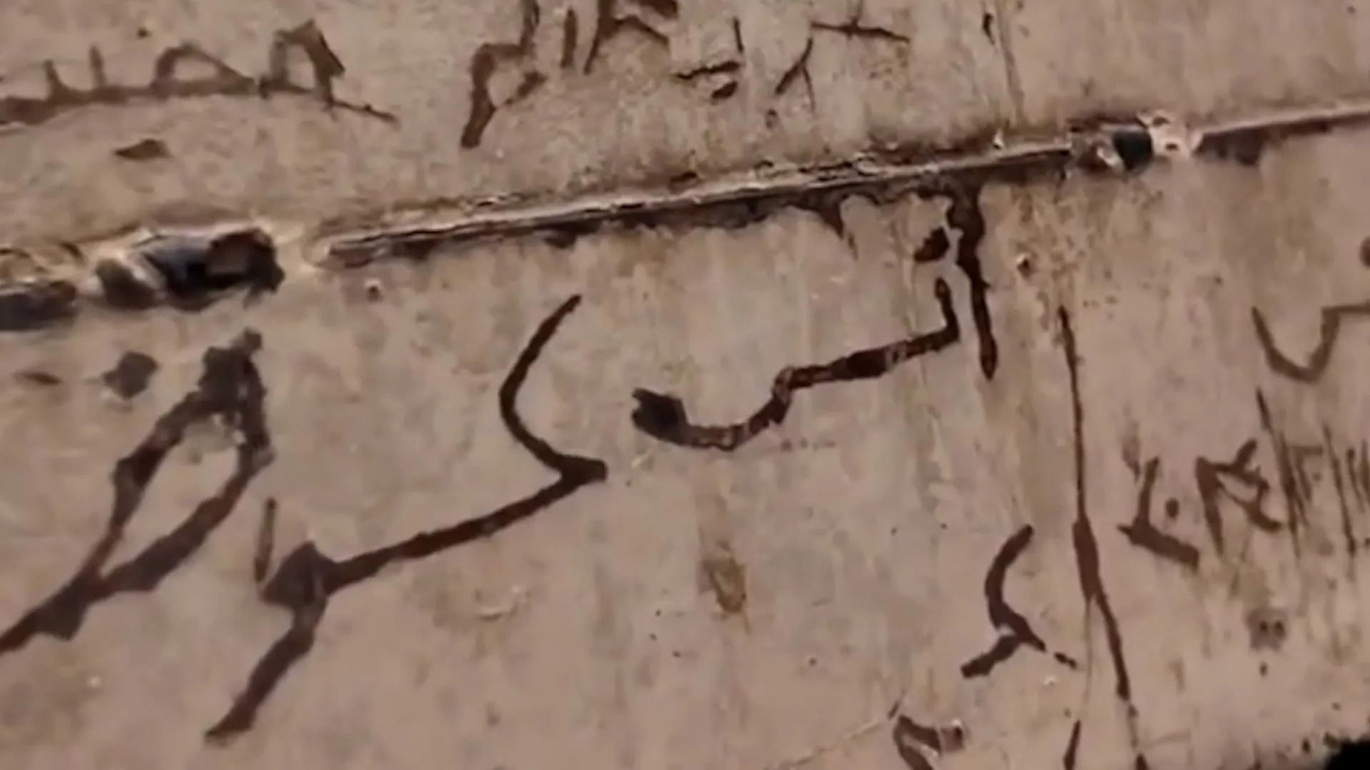 Syrian woman sees brother’s name on prison door at Damascus exhibit