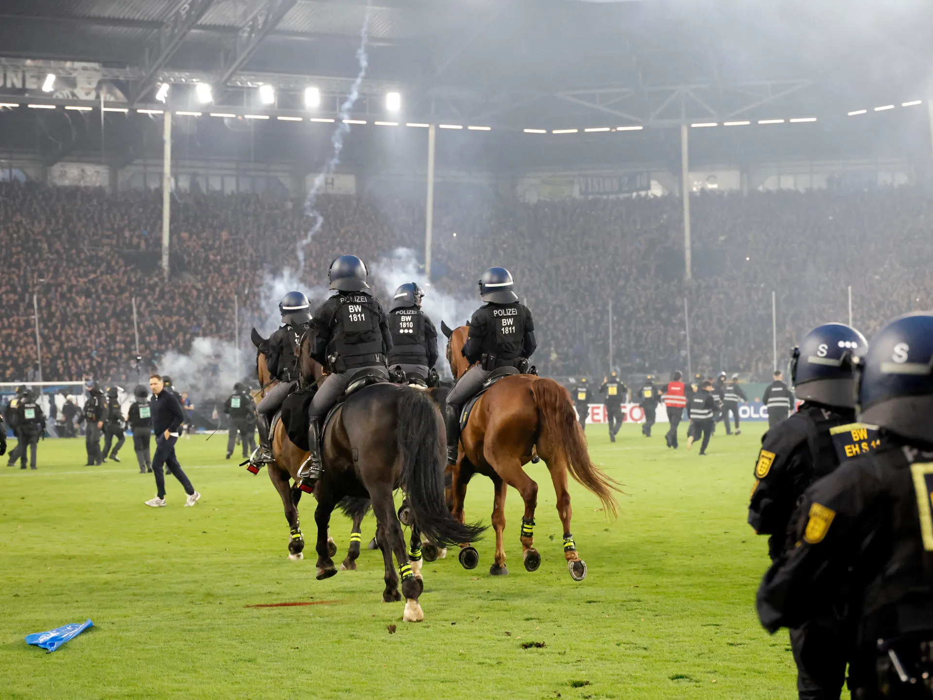 Violence Erupts at German Cup Match as Fans Storm Pitch, Leaving Around 100 Injured