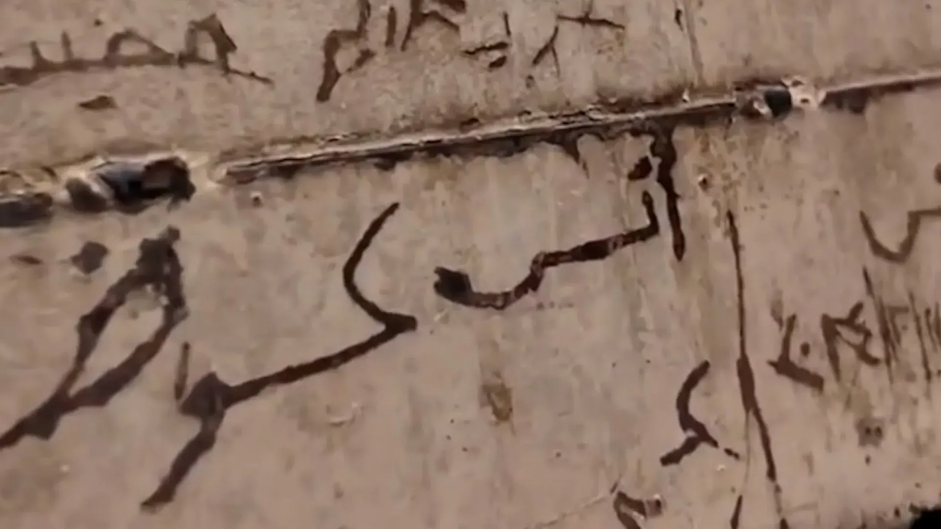 Syrian woman sees brother’s name on prison door at Damascus exhibit